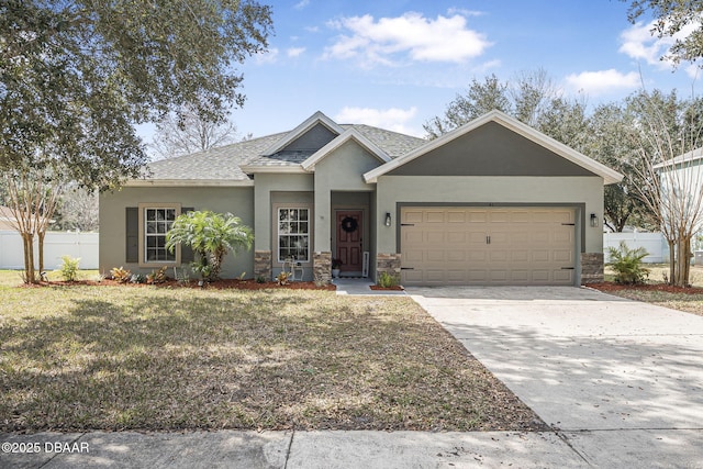 view of front of property featuring a garage and a front lawn