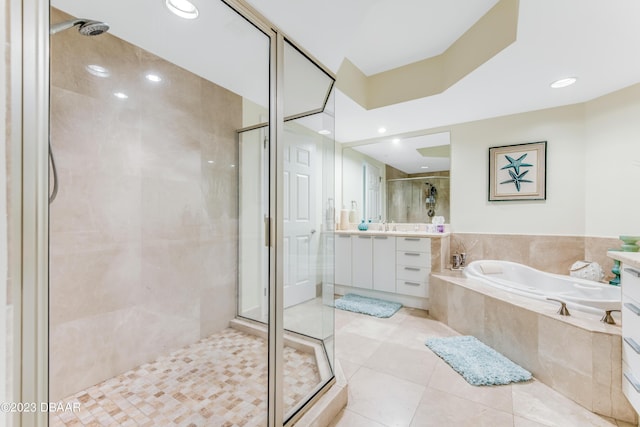 231 Riverside Dr Unit 1806, Holly Hill, FL 32117 - full bathroom featuring vanity, a shower stall, a garden tub, tile patterned floors, and recessed lighting