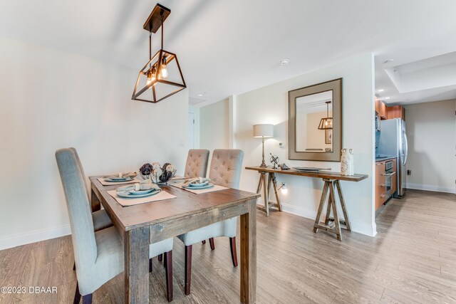 231 Riverside Dr Unit 1806, Holly Hill, FL 32117 - dining space with light wood-type flooring and baseboards