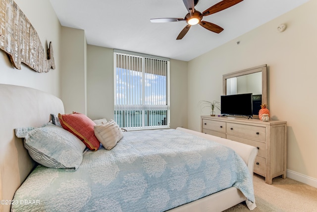 231 Riverside Dr Unit 1806, Holly Hill, FL 32117 - bedroom featuring light carpet and ceiling fan