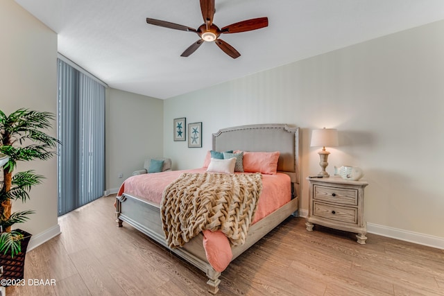 231 Riverside Dr Unit 1806, Holly Hill, FL 32117 - bedroom with wood finished floors and ceiling fan