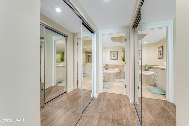 231 Riverside Dr Unit 1806, Holly Hill, FL 32117 - full bath with a garden tub, wood finished floors, vanity, and recessed lighting