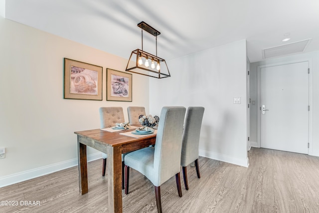 231 Riverside Dr Unit 1806, Holly Hill, FL 32117 - dining room featuring light wood-style floors and baseboards