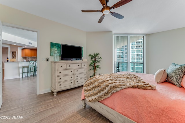 231 Riverside Dr Unit 1806, Holly Hill, FL 32117 - bedroom with wood finished floors and a ceiling fan