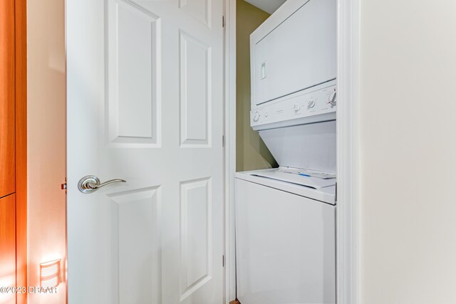231 Riverside Dr Unit 1806, Holly Hill, FL 32117 - laundry room with stacked washer / dryer