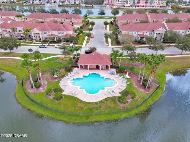 bird's eye view featuring a water view and a residential view