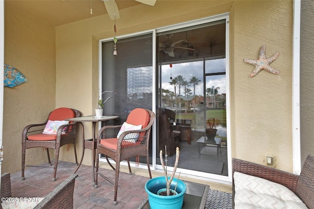 exterior space featuring a ceiling fan