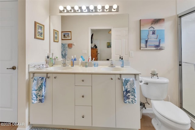 full bathroom with a shower with door, a sink, toilet, and double vanity