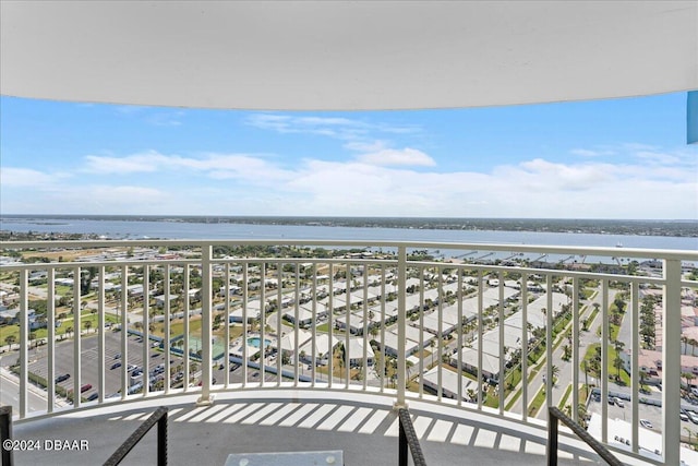 balcony featuring a water view