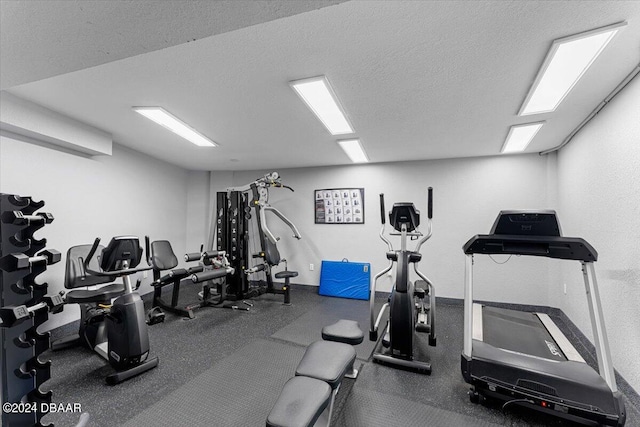 workout area with a textured ceiling