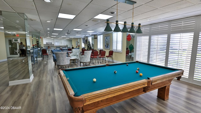 recreation room with pool table, hardwood / wood-style flooring, and a paneled ceiling