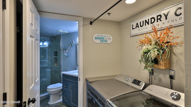 laundry room with separate washer and dryer