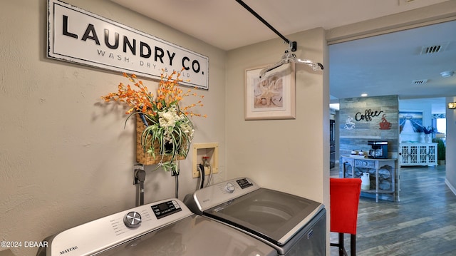 washroom featuring washer and dryer and dark hardwood / wood-style floors