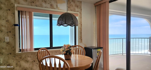 dining room featuring a water view