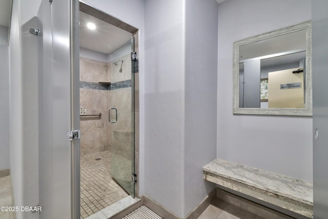 3003 S Atlantic Ave Unit 21A2, Daytona Beach, FL 32118 - full bathroom featuring a stall shower, tile patterned flooring, and baseboards