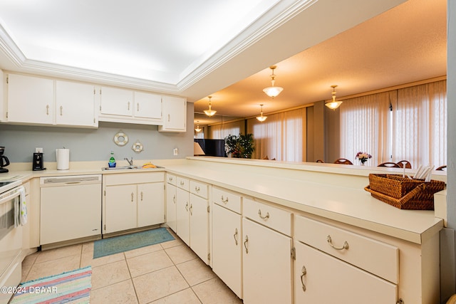 kitchen with white dishwasher, light countertops, crown molding, a sink, and light tile patterned flooring