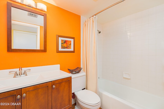 full bath featuring shower / bath combination with curtain, visible vents, vanity, and toilet