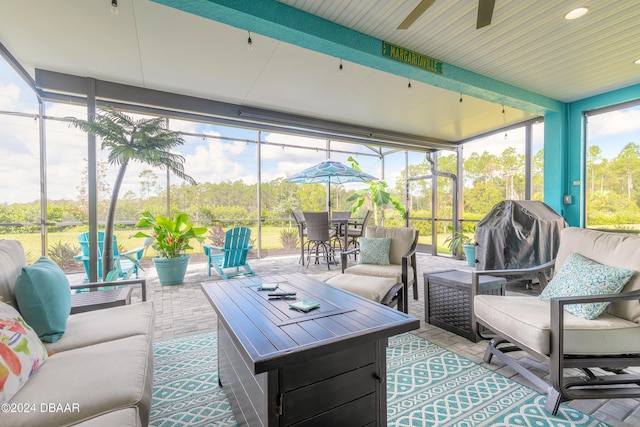 sunroom / solarium with ceiling fan and a healthy amount of sunlight