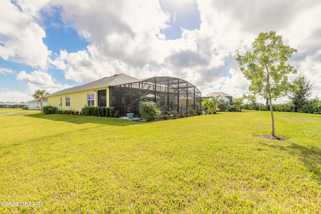 view of yard with a lanai