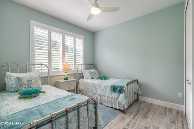 bedroom featuring light wood-type flooring and ceiling fan