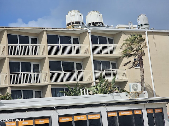 view of building exterior with ac unit