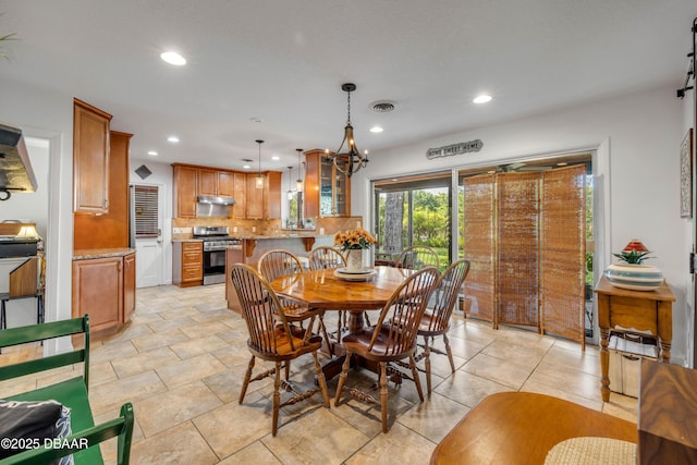 200 W Washington Ave, Deland, FL 32720 - dining space with recessed lighting and a chandelier