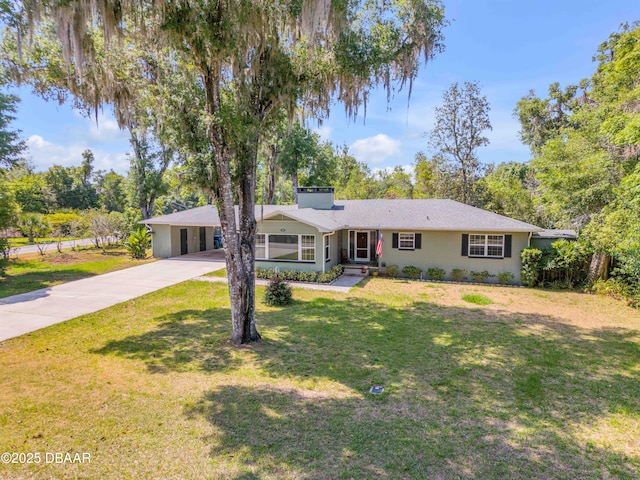 200 W Washington Ave, Deland, FL 32720 - single story home featuring driveway, a front lawn, a carport, and a chimney