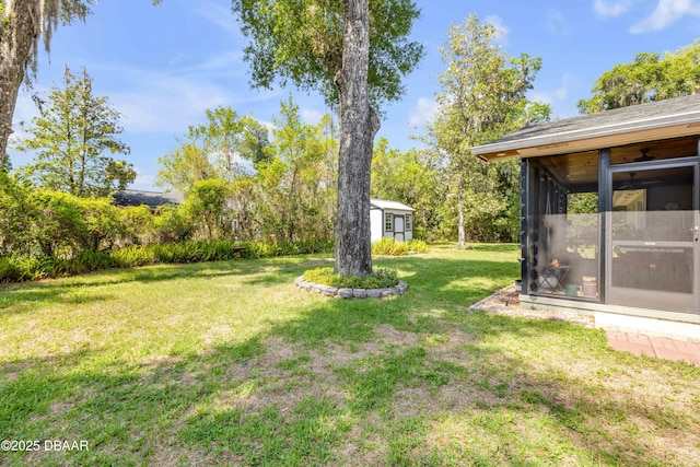 200 W Washington Ave, Deland, FL 32720 - view of grassy yard with a sunroom and an outbuilding