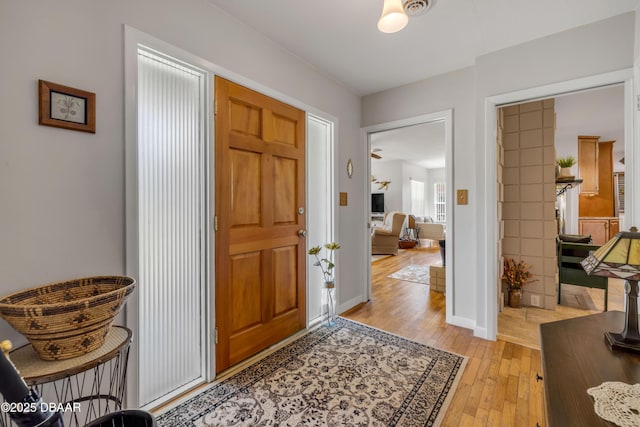 200 W Washington Ave, Deland, FL 32720 - entrance foyer with light wood-style flooring and baseboards