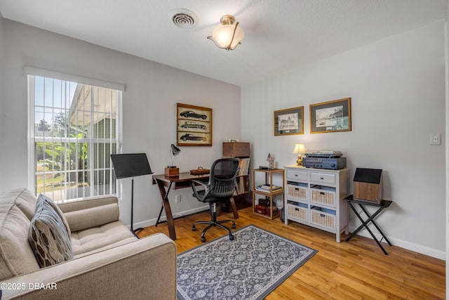200 W Washington Ave, Deland, FL 32720 - home office featuring wood finished floors and baseboards