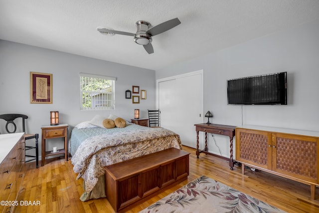200 W Washington Ave, Deland, FL 32720 - bedroom with light wood-type flooring, a closet, and a ceiling fan