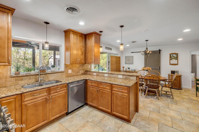 200 W Washington Ave, Deland, FL 32720 - kitchen with appliances with stainless steel finishes, a sink, brown cabinets, tasteful backsplash, and recessed lighting