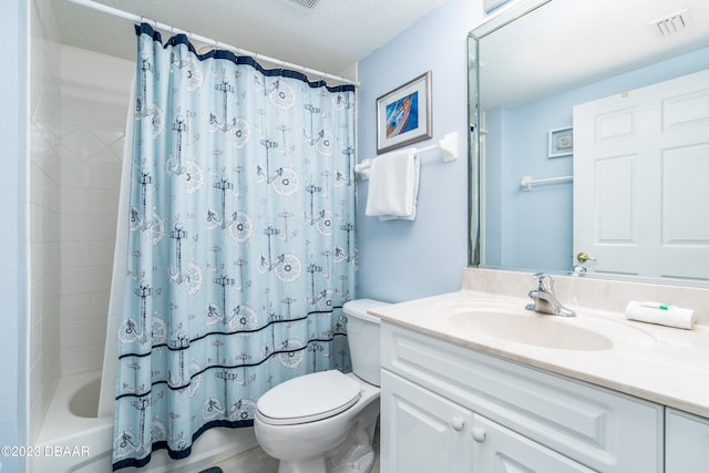 full bathroom with toilet, vanity, a textured ceiling, and shower / bath combo with shower curtain