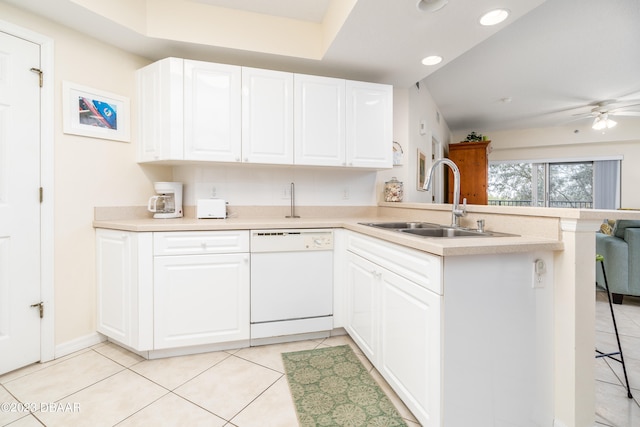 kitchen featuring sink, white cabinets, dishwasher, kitchen peninsula, and ceiling fan