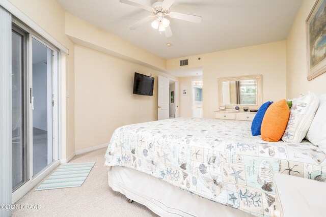 bedroom featuring light carpet and ceiling fan