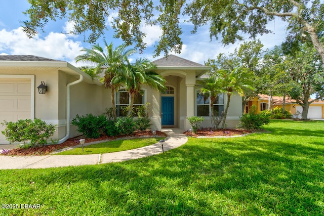 1832 Afshin Ct, Port Orange, FL 32128 - view of front of home featuring a front lawn, stucco siding, and an attached garage