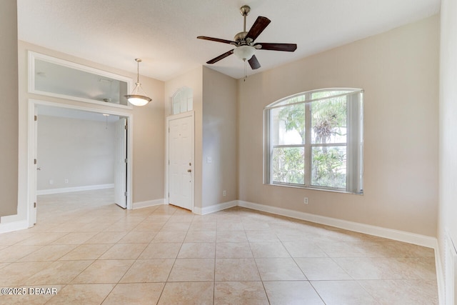 1832 Afshin Ct, Port Orange, FL 32128 - empty room featuring light tile patterned floors and a ceiling fan