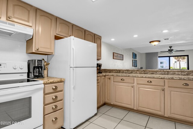 3800 S S Atlantic Ave Unit 105, Daytona Beach Shores, FL 32118 - kitchen with white appliances, under cabinet range hood, light tile patterned floors, ceiling fan, and recessed lighting