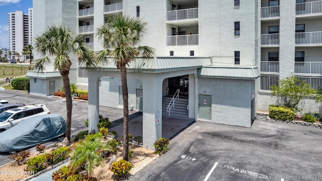 3800 S S Atlantic Ave Unit 105, Daytona Beach Shores, FL 32118 - view of apartment building / complex featuring uncovered parking