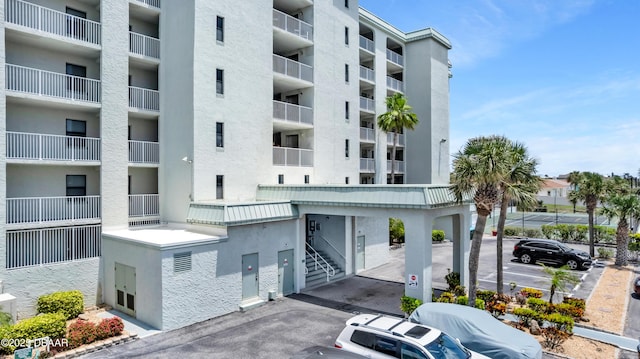 3800 S S Atlantic Ave Unit 105, Daytona Beach Shores, FL 32118 - view of apartment building / complex with uncovered parking