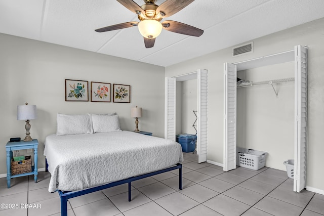 3800 S S Atlantic Ave Unit 105, Daytona Beach Shores, FL 32118 - bedroom featuring light tile patterned floors, a closet, a ceiling fan, and baseboards