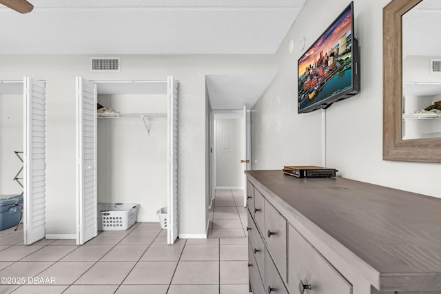 3800 S S Atlantic Ave Unit 105, Daytona Beach Shores, FL 32118 - bathroom featuring tile patterned floors, vanity, and baseboards
