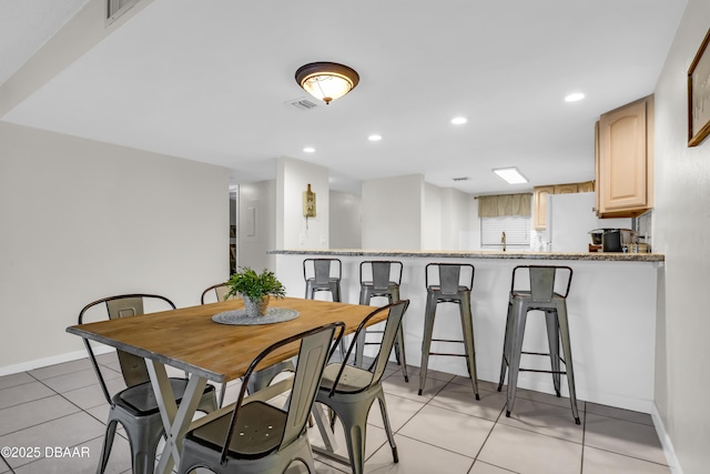 3800 S S Atlantic Ave Unit 105, Daytona Beach Shores, FL 32118 - dining space featuring light tile patterned flooring, baseboards, and recessed lighting