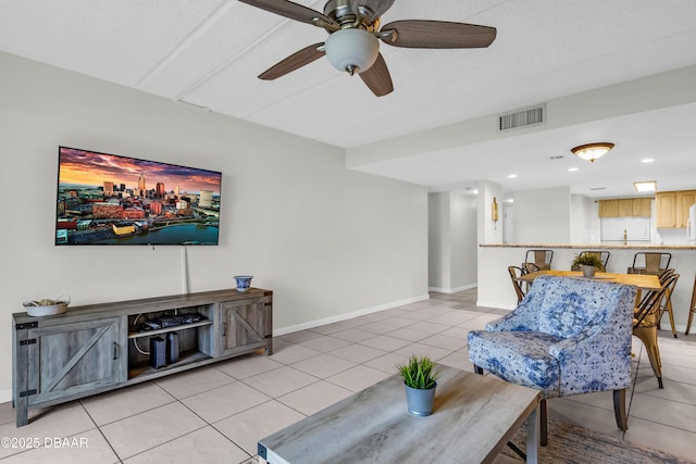 3800 S S Atlantic Ave Unit 105, Daytona Beach Shores, FL 32118 - living area featuring light tile patterned flooring, a ceiling fan, baseboards, and recessed lighting