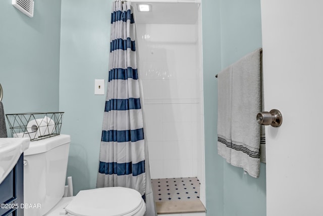 3800 S S Atlantic Ave Unit 105, Daytona Beach Shores, FL 32118 - full bathroom featuring toilet, a tile shower, and vanity