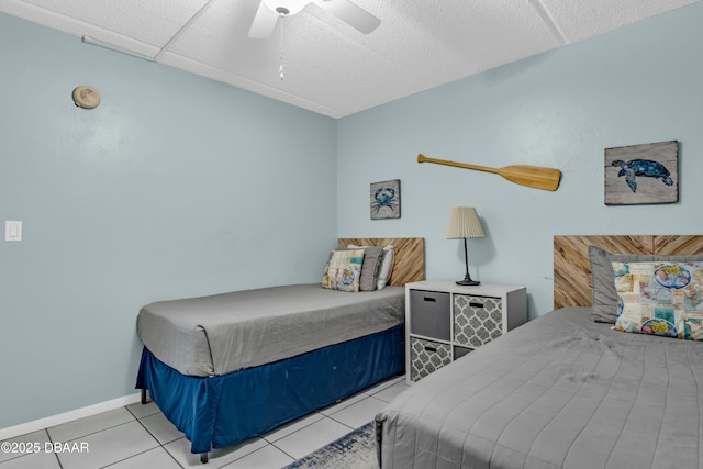 3800 S S Atlantic Ave Unit 105, Daytona Beach Shores, FL 32118 - tiled bedroom with ceiling fan and baseboards