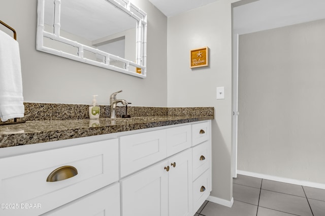 3800 S S Atlantic Ave Unit 105, Daytona Beach Shores, FL 32118 - bathroom with tile patterned floors, vanity, and baseboards