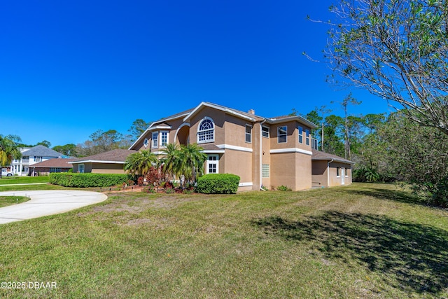 view of home's exterior with a lawn and stucco siding