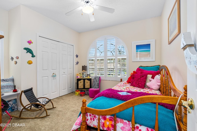 bedroom with a closet, carpet, and a ceiling fan