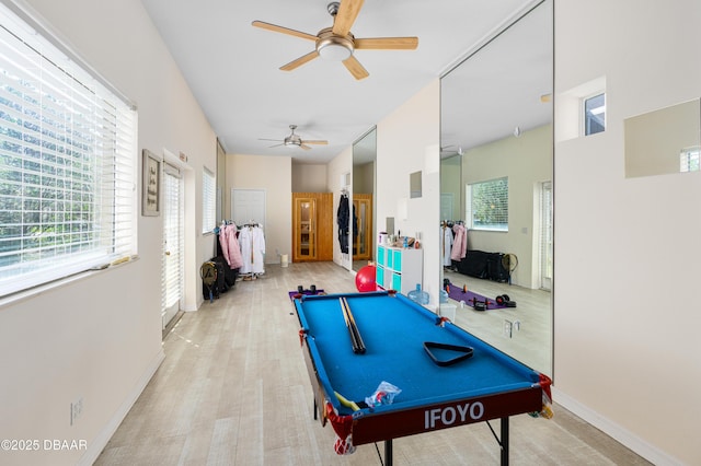 rec room featuring light wood finished floors, a ceiling fan, billiards, and baseboards